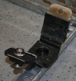 Bolt the cleat to the support structure using either the single central or two outer fixing positions