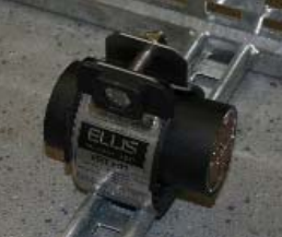 Remove the flange nut. Bend the two edges of the cleat around the cables until they are parallel. Locate the screw into adjacent hole and replace the flange nut