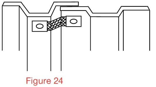Overlapping vertical joint bridged by flexible metal strapping