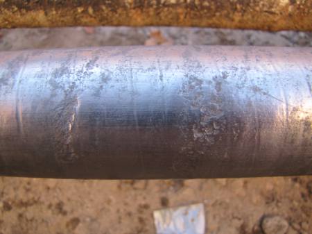Cathodic lead erosion is clearly visible on the EHV power cable