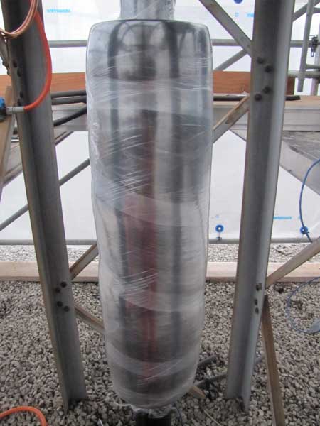 With the wrap completely installed, another moisture barrier is applied