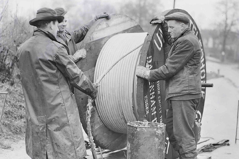 Engineers laying underground cable, 1951.
