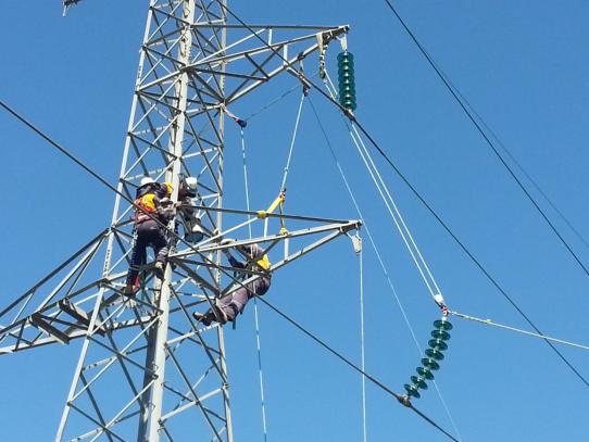 Remove Conductors & Change Tower Crossarm. Conductor Left Suspended From Insulators Below Block & Tackle