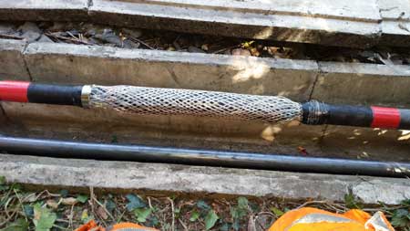 Cold Shrink Joint - once cables are cleaned and grease has been applied then the 3M cable splice body and tapes are installed. Grease is applied onto primary insulation, semi-conductive screen and connectors. Earth Continuity - copper screen sleeve or stocking is then positioned and constant force springs applied.