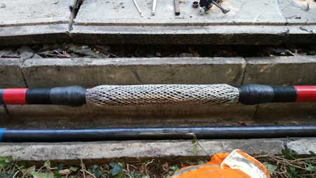 Taping Time - electrical and mastic tapes applied to both sides of the cable joint. 