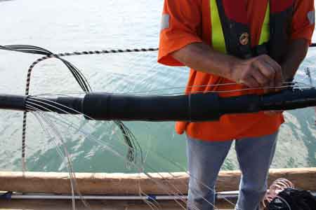 6. Inner 3M Cold Shrink cable splice body is cold shrink installed without the requirement for a heat source associated with the jointing of cables using heat shrink cable terminations. Aligned with marker tapes previously installed, then the concentric neutrals are brought back across the cable splice.