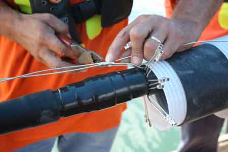 7. In this situation the high voltage splicing design was to have the neutrals individually crimped to each other, a soft mastic bed is made for the crimp sleeves to lie in to prevent damage to the insulation shield.
