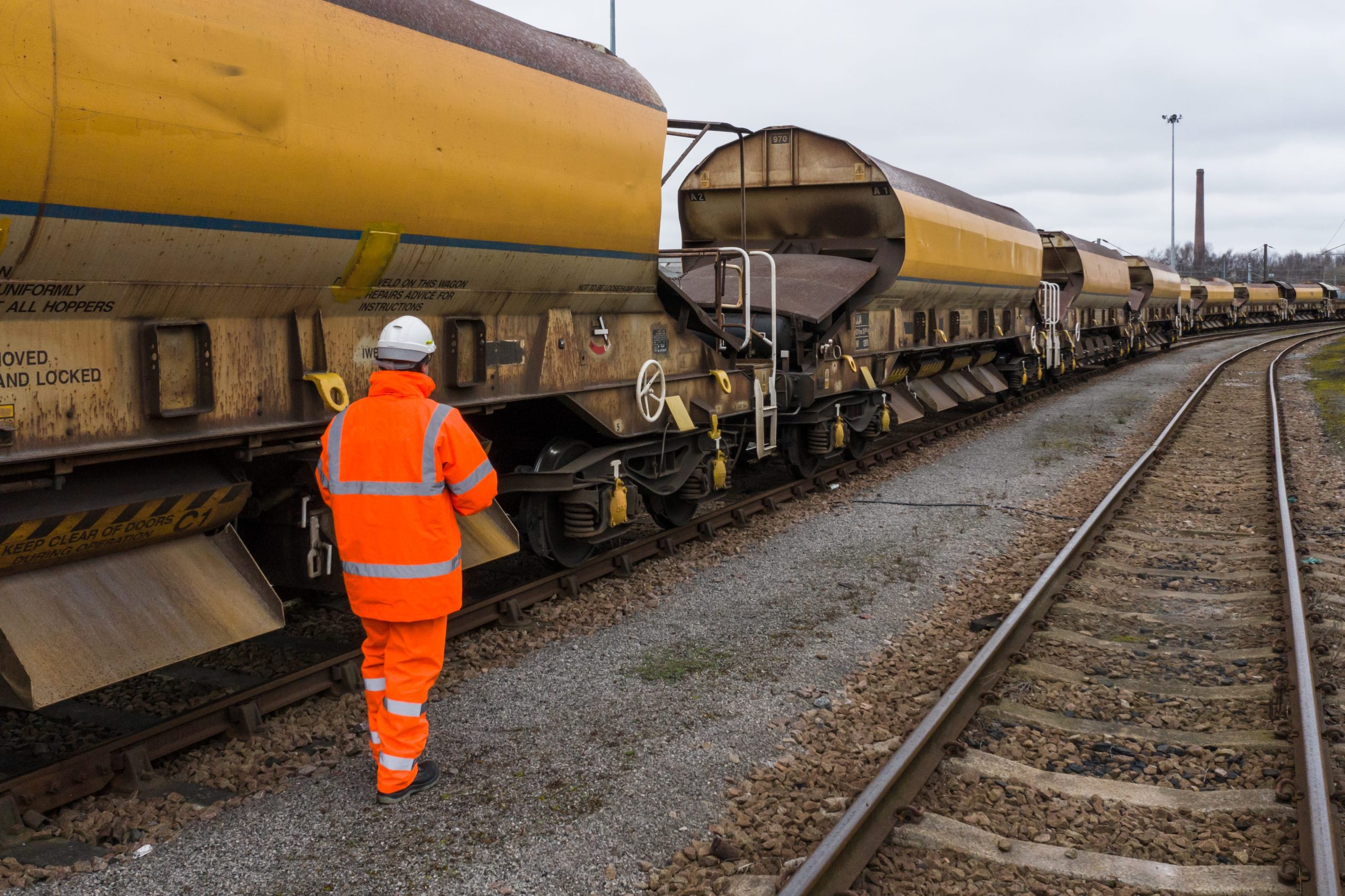 Network Rail worker inspecting goods train for HS2