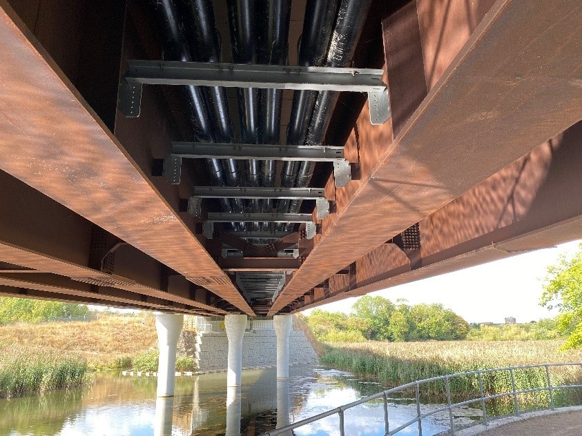 Cable brackets and duct installed on underside of bridge Cable brackets and duct installed on underside of bridge