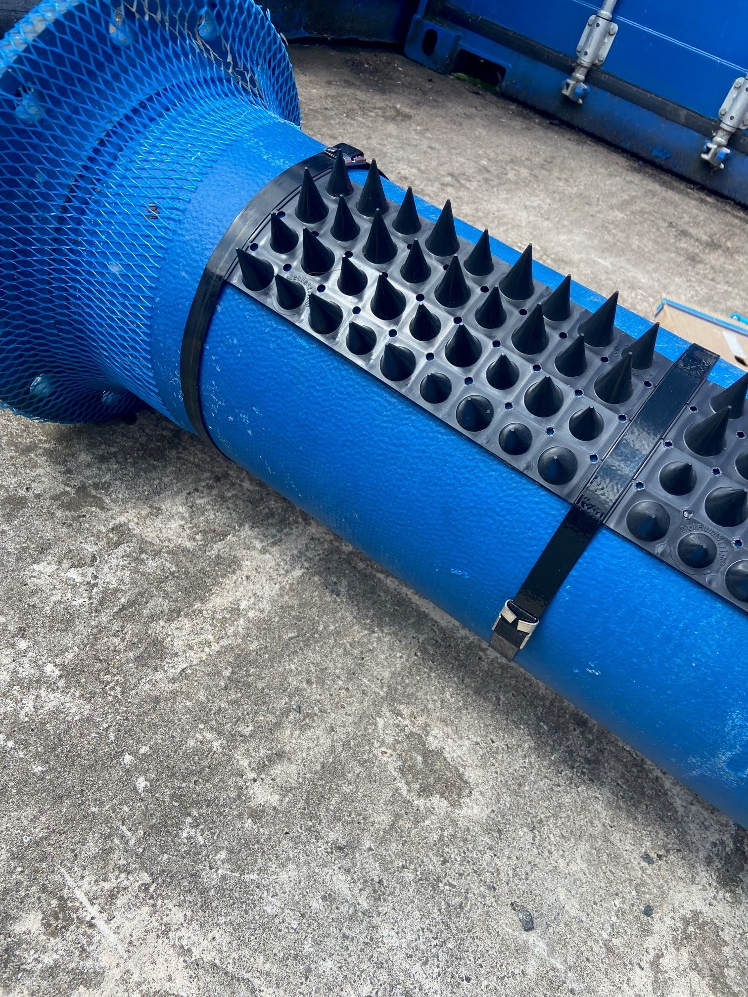 Anti climb spikes and signs attached to water pipes and signs that cross river and roads Anti climb spikes and signs attached to water pipes and signs that cross river and roads